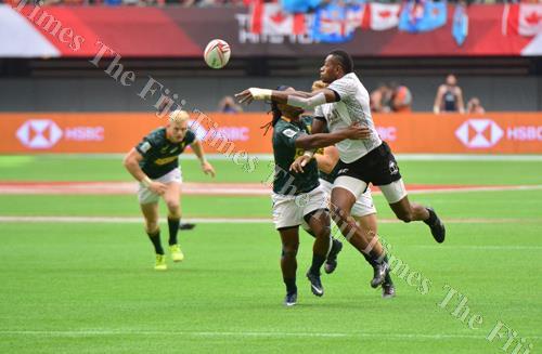 Sevuloni Mocenacagi off-loads during Fiji's semi-final clash against South Africa at the Canada 7s. Picture: JOVESA NAISUA