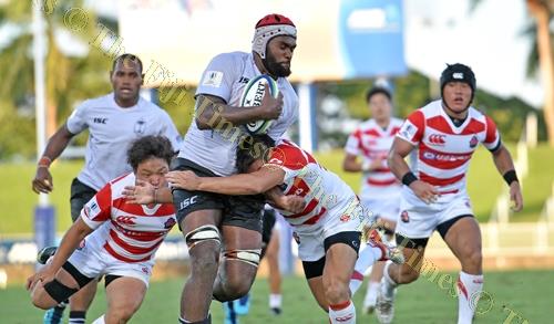 Viliame Rarasea of the Fiji Warriors is tackled by a Junior Japan player during a 2018 World Rugby Pacific Challenge match at the ANZ Stadium in Suva yesterday. Picture: RAMA