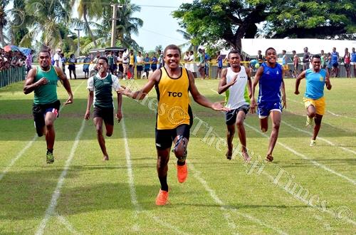 Livai Sikonatuidali (middle) of Tavua College celebrates after winning the junior boys 100m heats. Picture: BALJEET SINGH