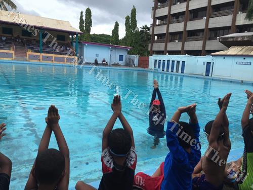Local instructor Caroline Puamau with children at the Olympic Pool in Suva. Picture: ANA MADIGINIBULI