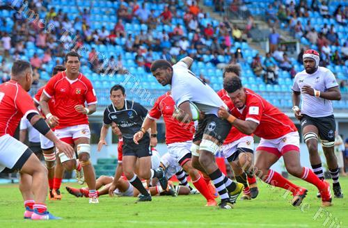 Fiji Warriors' inside centre Waisale Urabuta barges his way through the Tonga A defence to score a try during their World Rugby Pacific Challenge match at the ANZ Stadium in Suva yesterday. Fiji Warriors won the game 57-7. Picture: JONACANI LALAKOBAU