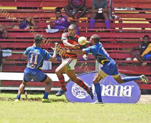 Aisake Katonibau "Ice" of Army Green looks for support against Tabadamu during the Uluinakau7's at Ratu Cakobau Park yesterday. Picture: RAMA