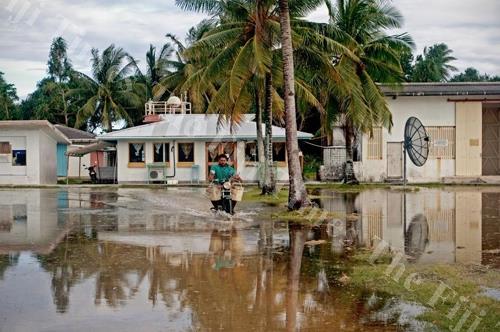 Flooding during king tides is a problem on Fongafale when water percolating up through the coral matrix laps even at the door of the meteorological office. Picture: SUPPLIED