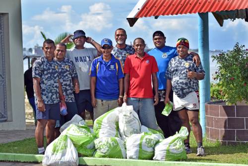 Volunteers from various organisations took the opportunity to collect rubbish and plant mangroves in a bid to save and protect the environment. Pictured is Navy volunteers with rubbish they collected. Picture: RAMA