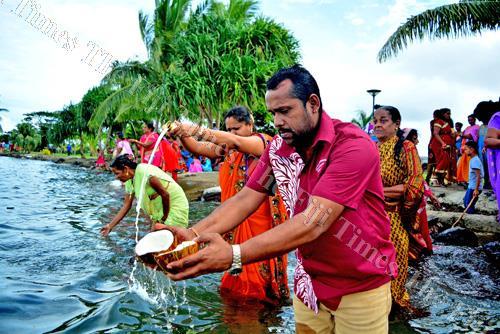 Sonny Ram (closet to camera) of Shiv Mandir Ramayan Bhanjan Mandali and devotess perfroming the last rituals of Ram Naumi at the Suva Foreshore yesterday. Picture: JONA KONATACI