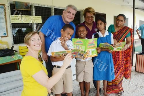 Rotary Club of Hilo Foundation Board Member Kathleen McGilvray (left), President Steve Howdy, and District Governor of Hawaii Nalani Flinn with Nadi Centre for Special Education Head Teacher Praveen Reena Devi and students pose for a photo after the donat