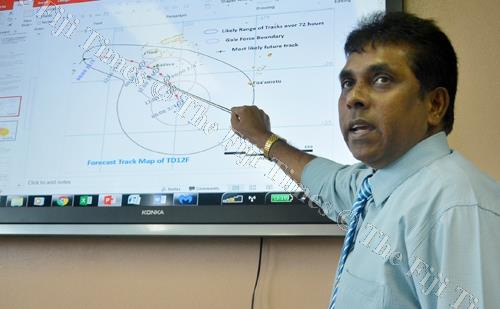 Fiji Meteorological Services director Ravind Kumar explains the projected path of the cyclone during the media briefing in Nadi yesterday. Picture: REINAL CHAND