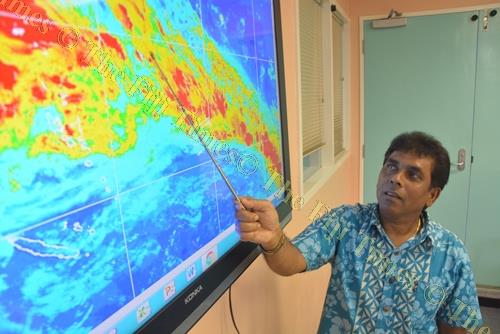 Fiji Meteorological Service director Ravind Kumar explains the weather patterns on a map during a media briefing in Nadi yesterday. Picture: REINAL CHAND