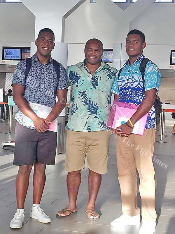Seeing off two rugby players who were products of Rugby Academy Fiji. Seremaia Bai (middle) with Etonia Bainivalu, who is now studying and playing rugby at St Bedes College, in Christchurch and Seremaia Bai Jr to Kelston Boys, Auckland. Picture: SUPPLIED