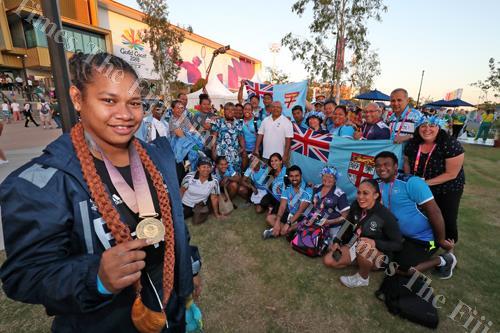 Gold medallist Eileen Cikamatana with members of Team Fiji after winning the 2018 Commonwealth Games 90kg weight-lifting competition at the Carrara Indoor Sports complex in Gold Coast, Australia. Picture: ELIKI NUKUTABU