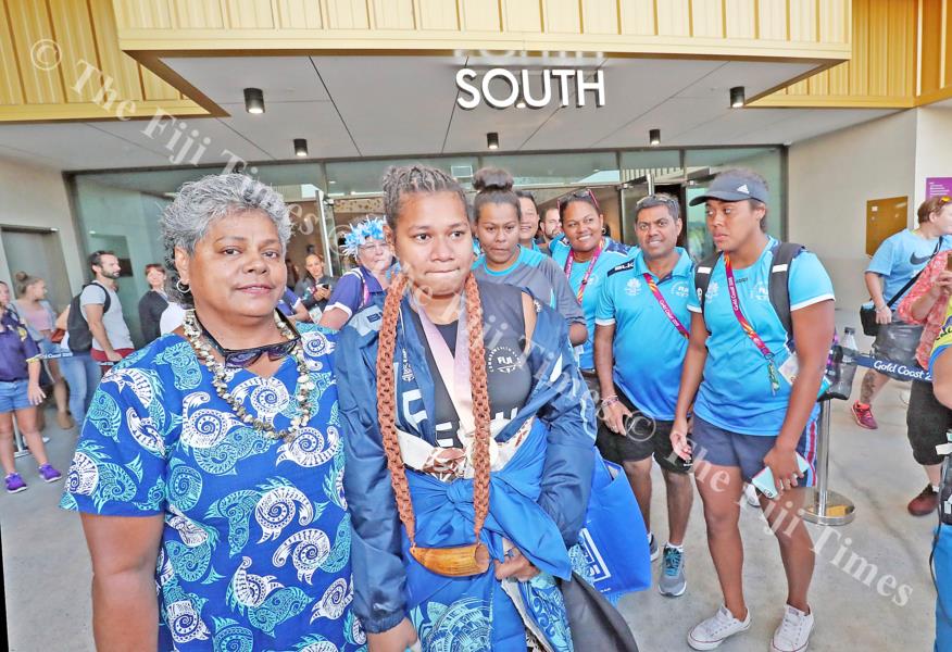 Eileen Cikamatana is led by mother Makitalena out of the Carrara Indoor Stadium. Picture: ELIKI NUKUTABU