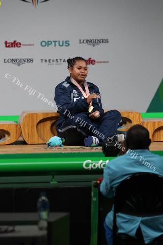 Eileen Cikamatana performs the traditional 'cobo' as a mark of respect after receiving her gold medal. Picture: ELIKI NUKUTABU
