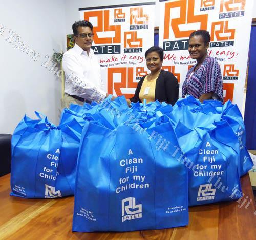 RB Patel general manager operations Jignesh Chauhan with Meena Sharma and a colleague at the handover. Picture: SUPPLIED