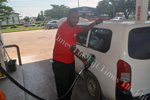 Semi Sailosi fills fuel in a car at Phil's Autoport in Lautoka. Motorists will fill the pinch in fuel prices from tomorrow after a recent price review. Picture: REINAL CHAND
