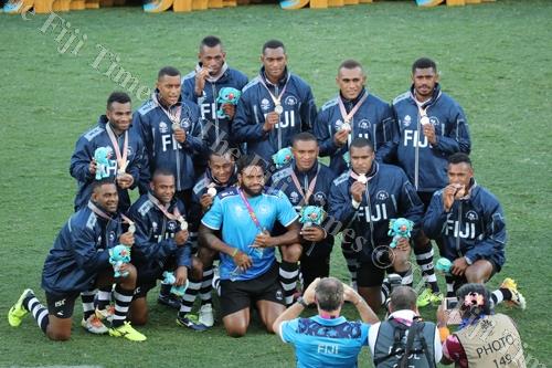 The Fiji sevens team pose for photographers after the Commonwealth Games rugby 7s medal presentations. Picture: ELIKI NUKUTABU