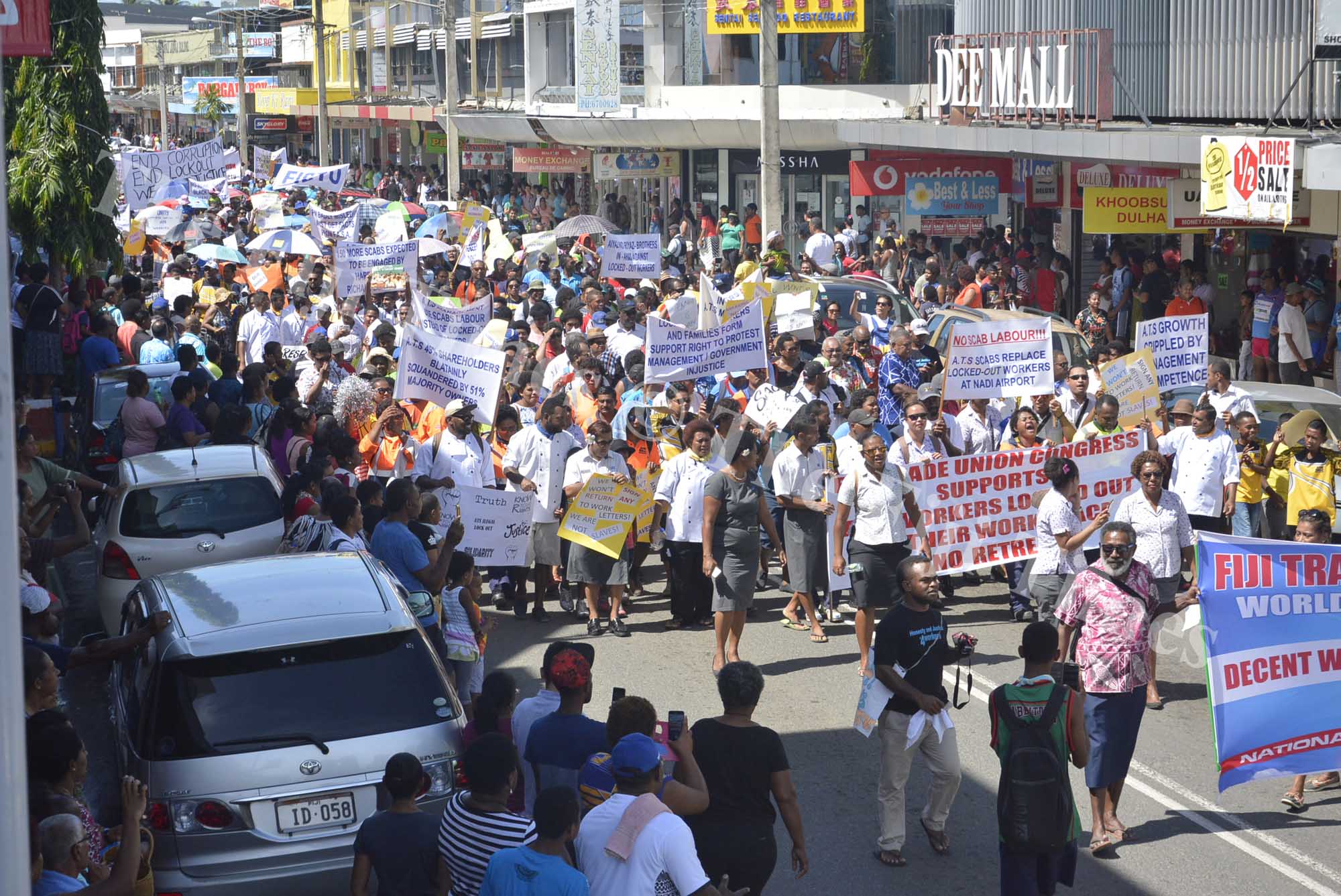 A large number of Union members and their supporters march through Nadi Town to raise grievances of the Air Terminal Service workers yesterday. Picture: REINAL CHAND