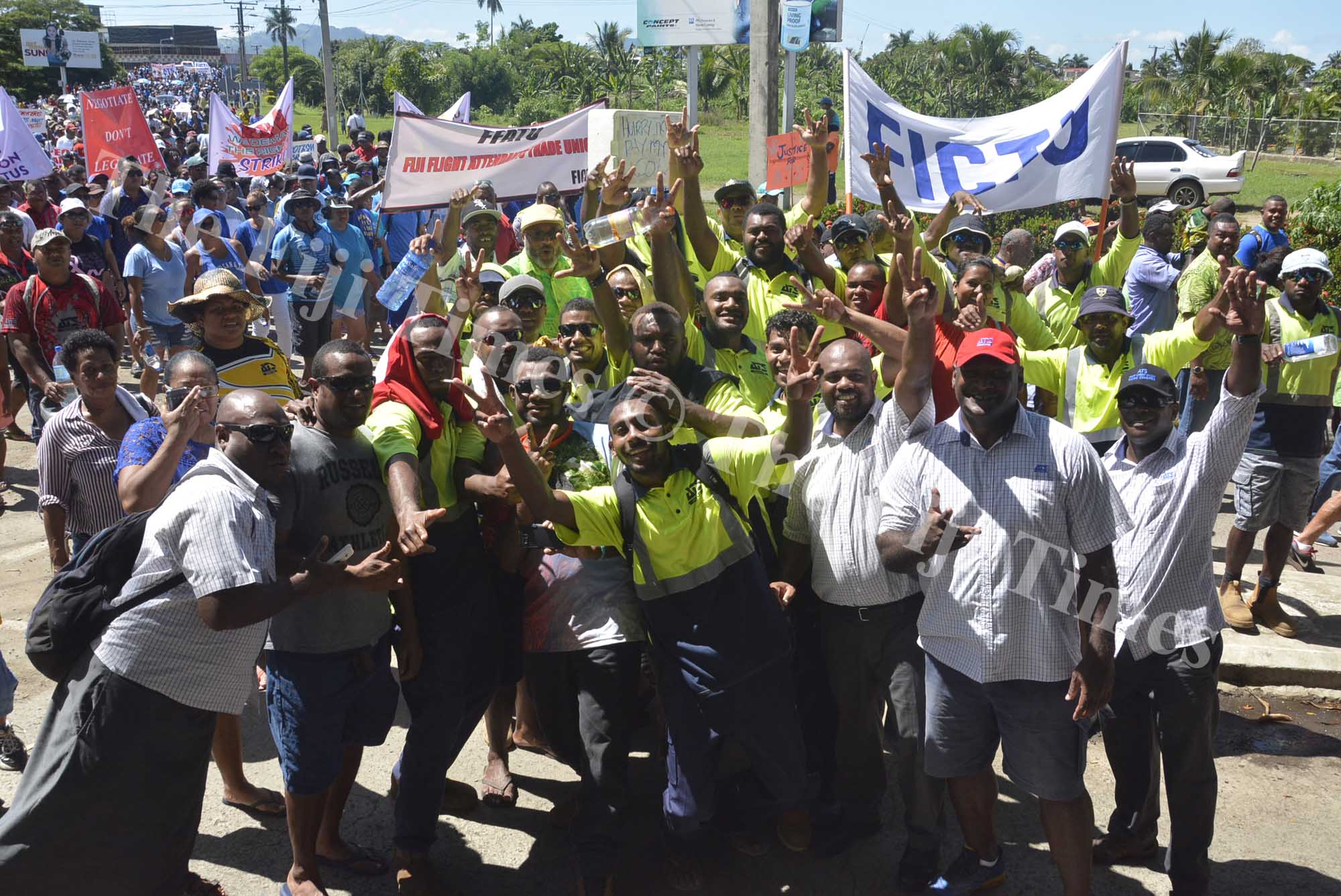 Air Terminal Services employees show unity as they march through Nadi Town yesterday. Picture: REINAL CHAND