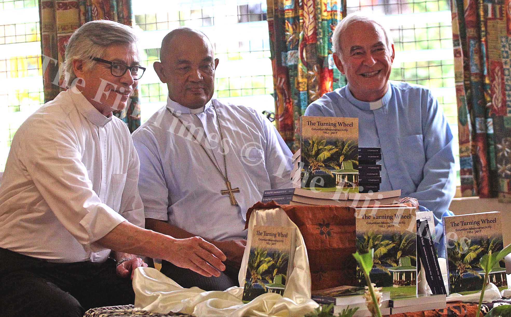 Father Arturo Aguilar,Archbishop Peter Loy Chong and Father Hoare following the book launch at the Archbishop Petero Mataca Hall yesterday. Picture: JONA KONATACI