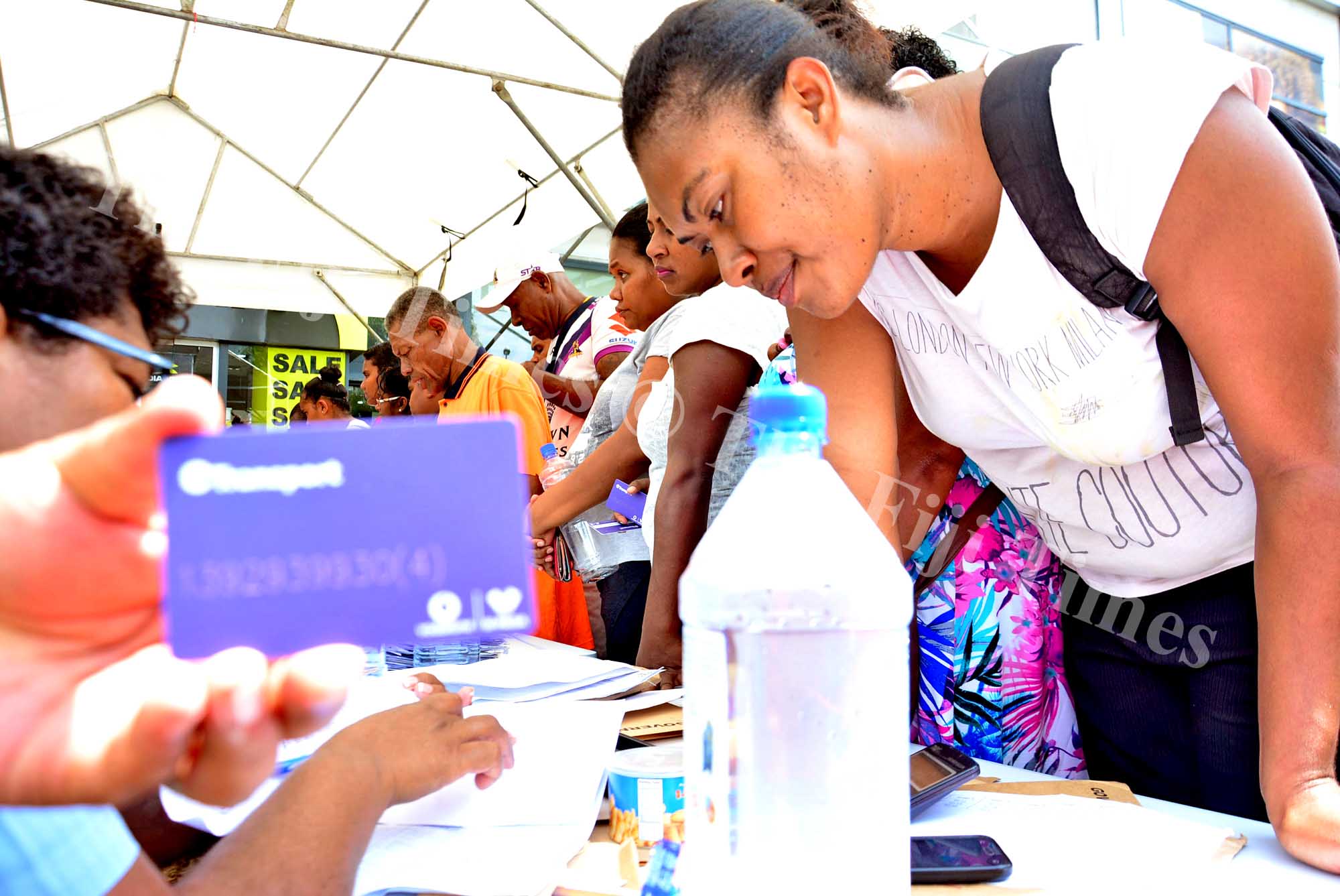 People queue up for assistance regarding students e-ticketing cards in Suva. Picture: JONACANI LALAKOBAU
