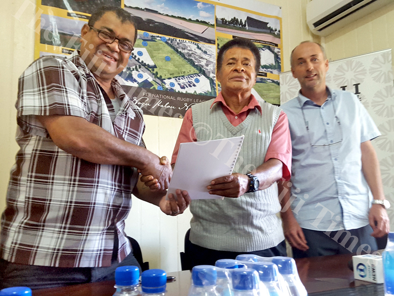 Fiji National Rugby League president Peni Musunamasi (left) shake hands with Mosese Kama (Nasinu Special Administrator) while CEO Lute Berends looks on, at the signing of the new FNRL grounds construction, in Suva. Picture: ELIKI NUKUTABU