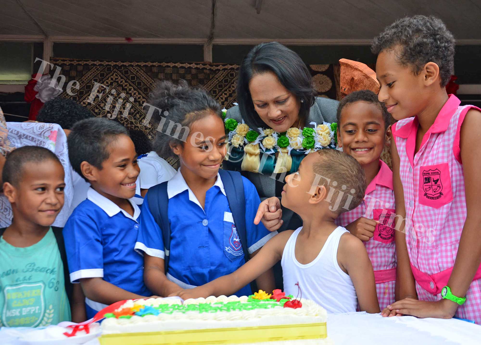Minister for Health and Medical Services Rosy Akbar shares a light moment with school children after the launch. Picture: JONACANI LALAKOBAU