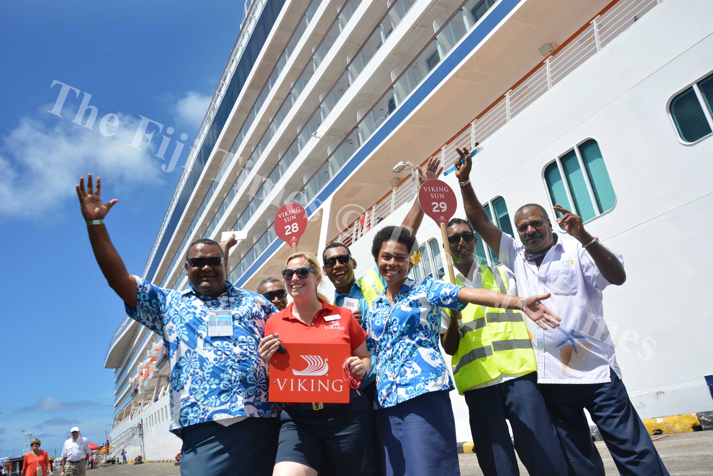 Staff of ARS Pacific with the Vikig Sun Excursions Staff member Tamara Courchay in front of the Viking Sun Cruiseliner berthed at the Kings Wharf in Suva yesterday. Picture: JOVESA NAISUA