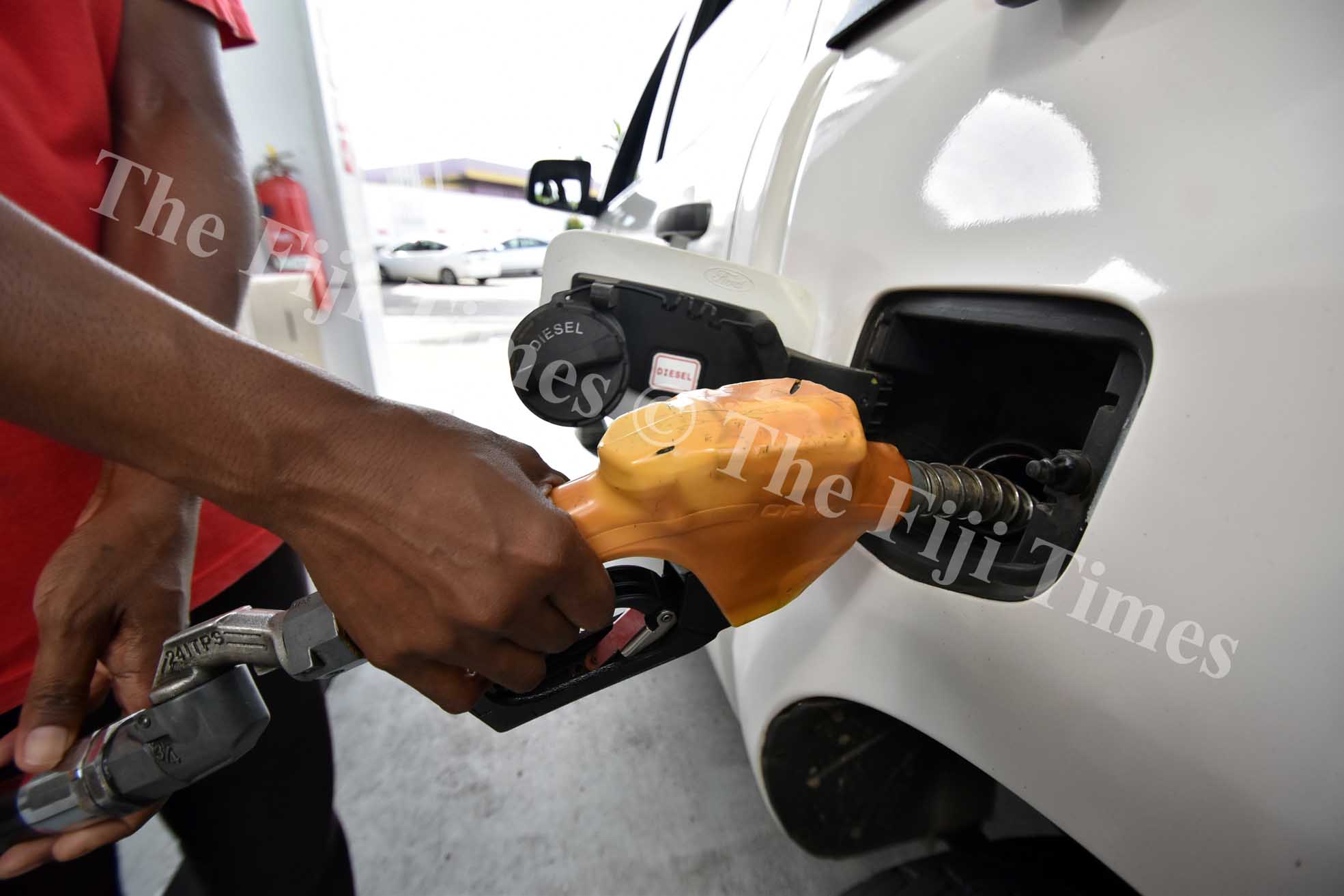 People fill up petrol yesterday as the new patrol price comes into effect from Monday. Picture: RAMA