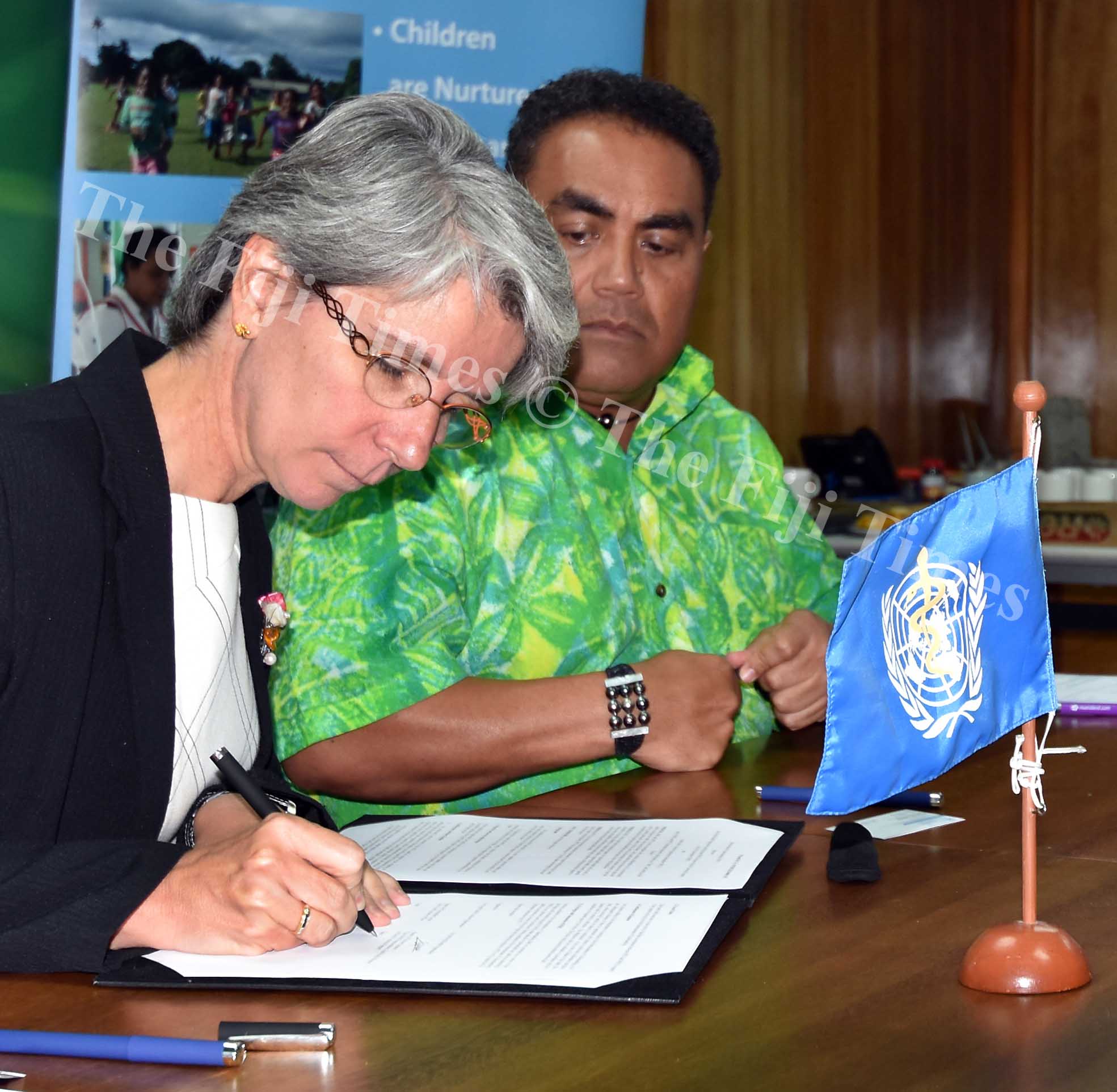 WHO director Pacific Technical Support Dr Corinne Capuano (left) and Head of SPTO Chris Cocker during the signing of MOU in Suva yesterday. Picture: RAMA