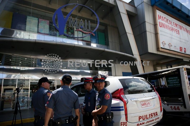Sacked security guard holds dozens hostage at Philippine mall - The ...