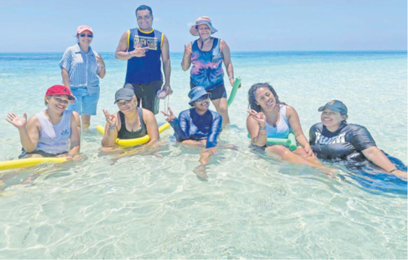 South Sea Cruises sales executive Sanjeshni Nand, front third from left, with other South Sea sailing vessel Sabre passengers enjoy their day out at the sand bank in the Mamanucas. Picture: BALJEET SINGH