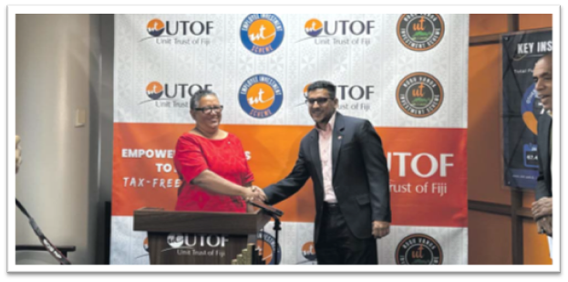 UTOF chairperson Lavinia Kaumaitotoya, left, and UTOF CEO Vilash Chand shake hands after announcing UTOF’s last dividend payout for 2024 at the UTOF head office in Suva yesterday. Picture: JOSEFA SIGAVOLAVOLA