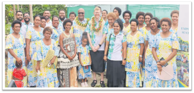 Minister for Trade Manoa Kamikamica and BAT Fiji general manager Sam Domor, centre with garland, and women from Bia-i-Cake Co-operatives in Nagigi Village, Savusavu. Picture: SUPPLIED/MINISTRY OF TRADE