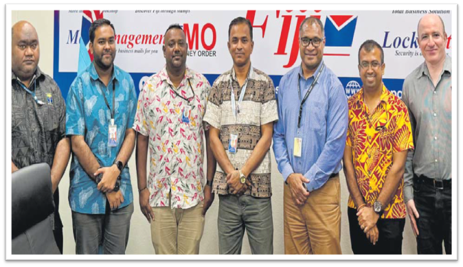 (L-R) Pena Vave, Rishal Narayan, Ashneel Kumar, Usween Ram, Ashneel Aman Singh and Ajay Narayan alongside Post Fiji CEO Isaac Mow (3rd from left) at the launch in Suva yesterday. Picture: JOSEFA SIGAVOLAVOLA