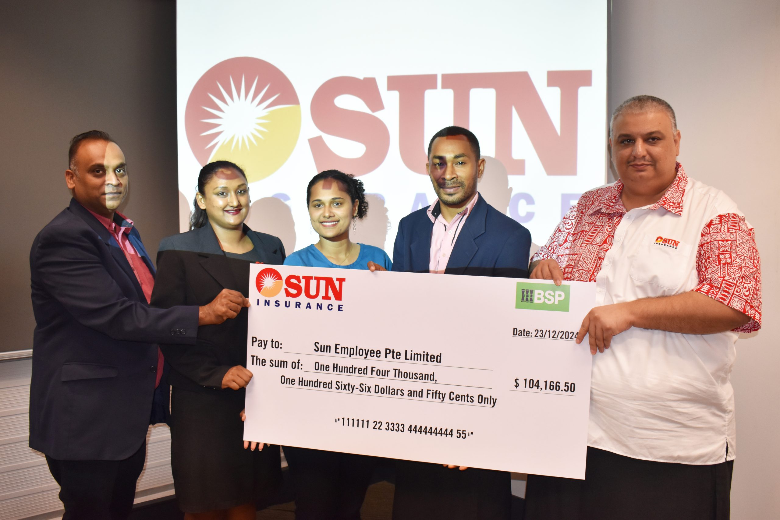 Sun Insurance staff and management during the handover at their office in Flagstaff, Suva. Picture: JOSEFA SIGAVOLAVOLA