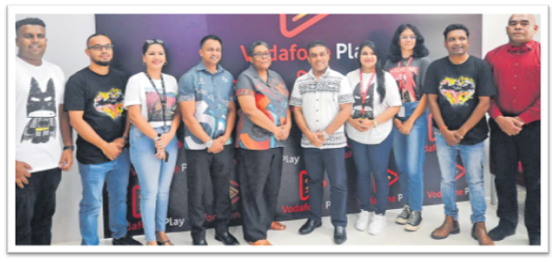 Vodafone Fiji CEO Elenoa Biukoto (fifth from left) with Fiji Television CEO Sunjeewa Perera (fifth from right) with Vodafone Fiji staff at the launch of Vodafone Play in Suva yesterday. Picture: JOSEFA SIGAVOLAVOLA