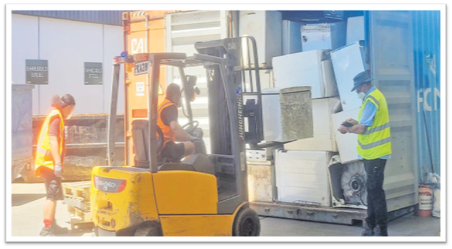 E-waste collected and transported from Fiji, including discarded electrical goods like washing machines and refrigerators being unloaded from a container after receipt in New Zealand. Picture: SUPPLIED