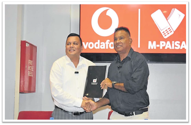 Damodar Group chief executive officer Div Damodar, left, with Vodafone Fiji’s head of e-commerce Shailendra Prasad renewed their M-PAiSA Blockbuster Wednesday partnership this week. Picture: DAMODAR CINEMAS