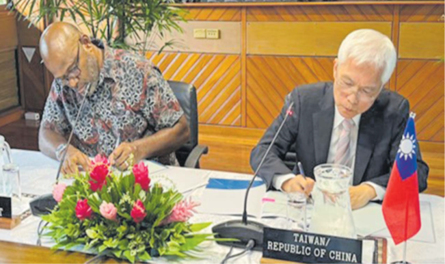PIFS deputy secretary-general Esala Nayasi, left, and representative of Taipei Trade Office in Fiji Joseph Chow last week signed the “Cooperation Agreement between Government of the Republic of China (Taiwan) and the Pacific Islands Forum Secretariat for the Benefit of the Office of the Pacific Ocean Commissioner from 2025 to 2027”. Picture: SUPPLIED