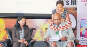 DPM and Minister forTrade Manoa Kamikamica is being garlanded as Consumer Council of Fiji CEO Seema Shandil looks on at the World Consumer Rights Day event at Albert Park in Suva yesterday. Picture: SUPPLIED