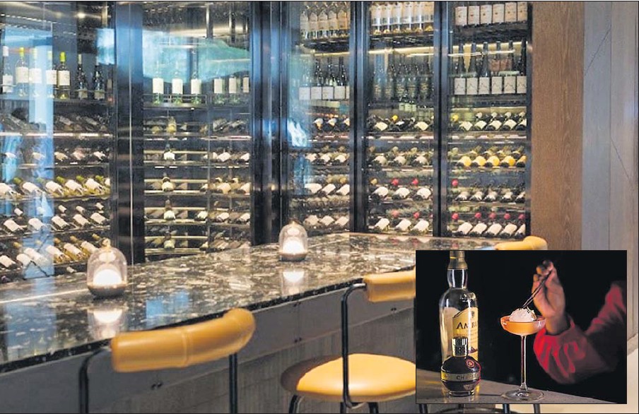 Located at the Sheraton Fiji Golf Club and Beach Resort, the Cellar & Barrel reopened its doors on March 13. Picture: SUPPLIED Inset: Guests OF Cellar & Barrel are also able to store whiskey purchased in wooden casings that are locked and engraved with the guest’s name. Picture: SUPPLIED