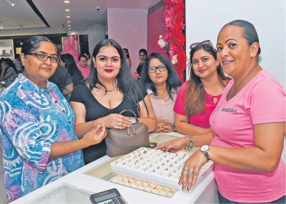 Prouds staff member Eileen Lee, right, is pictured here with some customers who attended the Prouds Pandora media coverage event held at the Prouds outlet in Suva on Wednesday. Picture: JONACANI LALAKOBAU