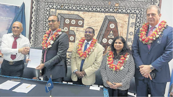 Fiji Airports board chairman Hasmukh Patel (left) and IFC Regional Industry director for Infrastructure and Natural Resources in Asia and the Pacific Vikram Kumar shake hands after the signing of the agreement in Nadi on Tuesday this week. With them are World Bank and IFC regional directors. Picture: SUPPLIED