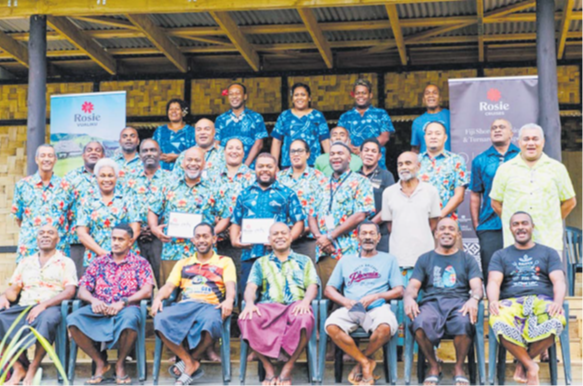 Rosie Travel Group general manager Eroni Puamau (second row, third from left) with managing director of Muanivatu Trails, Epeli Asaro (fourth from left) in a group photo with representatives from Rosie Travel Group, Tourism Fiji, Muanivatu Trails and community-based tourism operators during the signing ceremony at Vuadomo Village in Savusavu. Picture: SUPPLIED