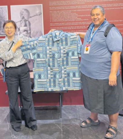 Suva City Council IT expert Albert Wong, right, hands over his “Bula” shirt to a staff at the Luxseven Museum as souvenir to be added to its exhibition. Picture: JOSEFA SIGAVOLAVOLA