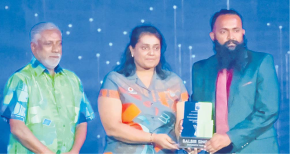 FDB Board chairman Damend Gounder, left, Vodafone Fiji’s head of brands, marketing and digital Saleshni Chand awarding Futuristic Farms founder Balbir Singh a plaque for winning the Young Entrepreneur for FDB’s NSMEA 2024 at the official awards ceremony last week. Picture: JOSEFA SIGAVOLAVOLA