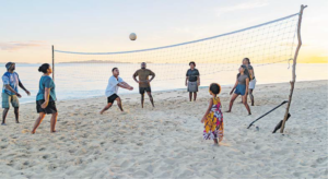 Wilson soars through the airin a game of beach volleyball.
Picture:SUPPLIED