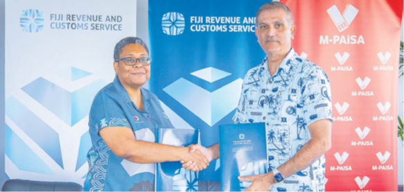 Vodafone Fiji CEO Elenoa Biukoto, left, with FRCS CEO at the MOA signing at the FRCS head-office in Nasese yesterday. Picture: SUPPLIED