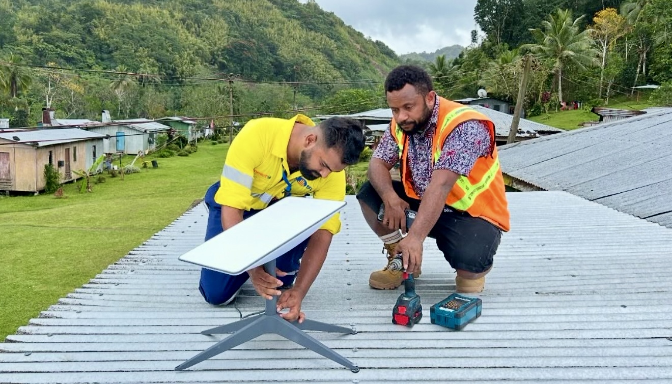 Telecom Fiji Ltd technicians install a Starlink dish in a village in remote Fiji. A new Starlink-based, managed Wi-Fi model of data connectivity will now be rolled out by Government to these areas. Picture: TELECOM Fiji