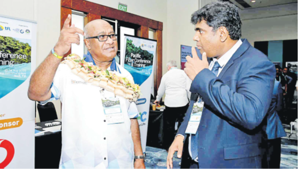 Deputy Prime Minister and Minister for Trade, Cooperatives, MSMEs and Communications Manoa Kamikamica (left) chats with Telecom Fiji Ltd chief executive officer Charles Goundar during the Pacific Fiber and Training Conference held at the Sofitel Fiji Resort and Spa on Denarau in Nadi yesterday. Picture: REINAL CHAND