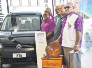 KY6 members with their new vehicle.Right: DPM Manoa Kamikamica receives a token of appreciation
from KY6 members.